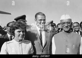 World Bank President Robert McNamara, center, flew with Mrs. Margaret  McNamara for one-week familiarization tour, Nov. 17, 1968, New Delhi,  India. He was received at the airport by Deputy Prime Minister Moraarji