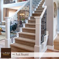 White Wood Railings And Wrought Iron Spindles Create The Perfect Contrast For Wrought Iron Stairs Wrought Iron Stair Railing Stair Remodel