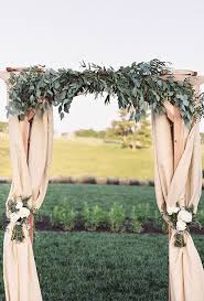 Brides Com 55 Amazing Ceremony Structures Colorful Ceremony Altar With Rose Covered Flower Wall And I Eucalyptus Wedding Decor Wedding Pergola Outdoor Wedding