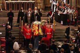 The royal couple are pictured relaxing on the grass at a. Queen Elizabeth The Queen Mother Westminster Abbey