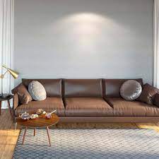 The plump sofa looks inviting and makes it easy to imagine cozy warm nights especially with the fireplace in front. What Color Walls Goes Best With Brown Sofa 25 Suggestions With Pictures Home Decor Bliss