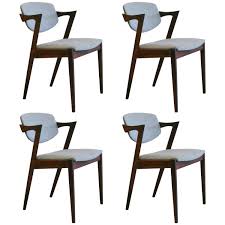 Vintage Rosewood Model 42 Dining Chairs By Kai Kristiansen 1stdibs Com Vintage Rosewood Antique Dining Room Chairs Dining Room Chairs