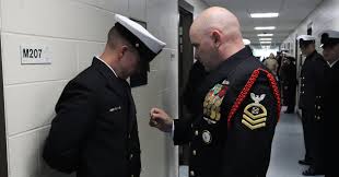 Students in Officer Candidate School (OCS), class 03-25, at Officer  Training Command Newport (OTCN), report for their Officer Personnel  Inspection. Officer Personnel Inspection (OPI) measures a candidate's  knowledge about any topic eligible