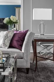 Grey couch with colorful pillows. 15 Ways To Style A Grey Sofa In Your Home Decor Aid