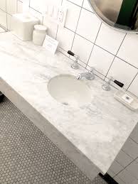 Carrara venato polished hexagon nero strip marble mosaic tile. Small Bathroom Here S How To Make It Seem Bigger Designed