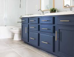 Custom built cabinetry will always offer a quality product, but a slick of navy blue paint and some new handles can instantly update a chest or buffet converted to a bathroom vanity. Spmavenumg2kfm