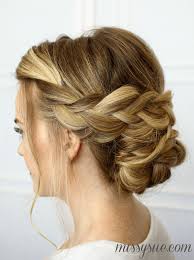 Just make a low ponytail and roll up the hair. Soft Braided Updo