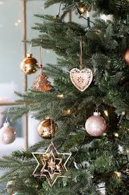 Rose gold ornaments and decorations are a new spin on the traditional silver and gold approach. Pin By El La On A Christmas Cottage Copper Christmas Gold Christmas Decorations Rose Gold Christmas