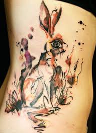50 Awesome Animal Tattoo Designs Cuded White Rabbit Tattoo Rabbit Tattoos Rib Tattoo