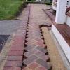 Amp up your yard by laying a herringbone brick pattern. 1