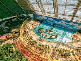Take A Look Inside The World S Largest Water Park That S Located In A Former Airship Hanger Indoor Waterpark Water Park Beautiful Places To Travel