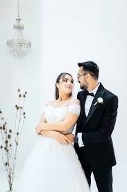 Man in Black Suit Jacket Hugging Woman ...