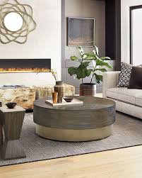 The table comes with two matching stools, each with caster wheels at the bottom for ease of movement. Bernhardt Profile Round Coffee Table
