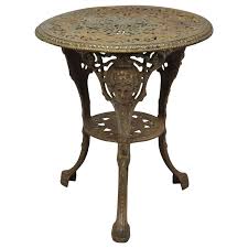 The table is paired with two matching, windsor styled, bar height amish dining room chairs. Vintage English Victorian Style Cast Iron Britannia Heads Garden Pub Table For Sale At 1stdibs