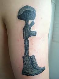 The tattoo of a fallen soldier on the skin acts as an immortal remembrance of all those who left their hearts and souls on the battlefield. Battlefield Cross Tattoos Tattoo Quotes