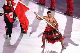 The person proudly displays the country's flag during the parade. The Best Part Of The Opening Ceremony Is Tonga S Flag Bearer