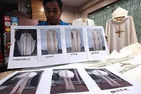 A Worker At The Talleres De Nazaret In Brgy Teachers Village Quezon City Shows Photos Of The Official Chasuble Miter An Quezon City Show Photos Pope Francis