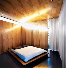 Set your bed with a nice bedding and add layers of fabric of different colors and textures to make your bed to look interesting. Here S How To Put Your Bed On The Floor Without It Looking Sloppy Dwell