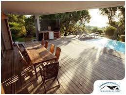 Learn how to build a deck with our comprehensive diy guide which includes tips on timber deck designs, building the frame, pile spacing & nz regulations. The Pros And Cons Of Raised And At Grade Decks Masters Roofing