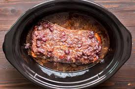 Season pork loin with garlic powder and place in the greased pot. Slow Cooker Cranberry Pork Loin The Magical Slow Cooker