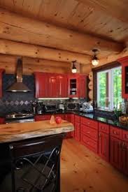How To Paint Wood Cabinets Hunker Rustic Kitchen Red Kitchen Cabinets Cabin Kitchens