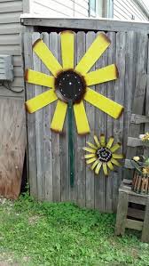 My Sunflower I Made Using Old Ceiling Fan Blades And A Old Pan I Found I Love Sunflowers Fan Blade Art Ceiling Fan Art Ceiling Fan Crafts
