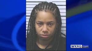 Mobile woman accused of hitting man with car