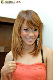 Short Asian ladyboy Bami strokes her stiff wiener as she strips - Pichunter