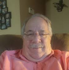 Why do caddies at The Masters all wear white boiler suits?