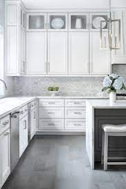White cabinets shown with weathered gray floors similar to ours. A Modern Farmhouse Kitchen In Austin Texas Grey Kitchen Floor Kitchen Remodel Small Kitchen Renovation