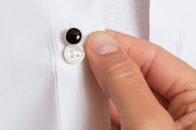 To fasten the cuff, the holes on both side of the cuff opening are lined up, the cufflink is inserted through so that the post runs all the way through all the holes, and the link is then set into its closed position. How To Wear Cufflinks And Studs 5 Simple To Follow Steps Jfw