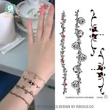 The tattoo is made to appear as if one is wearing a bracelet on their hand. Women Tattoo Hand Wrist Arm Leg Rose Flower Bracelet Waterproof Temporary Fresh Water Transfer Tattoo Body Art Sticker 105x60mm Stickers Bike Sticker Cardstickers Textile Aliexpress