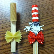 Cat in the hat pom pom transfer using a strawberry huller. Cat In The Hat Bookmark Craft For Reading Night Seuss Crafts Dr Seuss Crafts Crafts For Kids