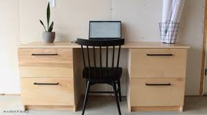 A simple desk, consisting of two file cabinets and a work surface can be whipped up quickly. Diy Cabinets And An Easy Modular Home Office Desk Idea