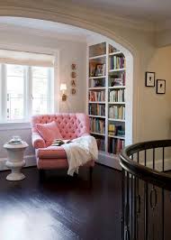 Oversized Reading Chairs Are So Inviting We Love How This Pink Corner Reading Chair And Built In Bookshelf Make For A Home Cozy Reading Corners Home Libraries