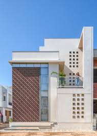 A Patterned Accent Wall Made From Cut Clay Roof Tiles Is Featured On The Exterior Of This New Home