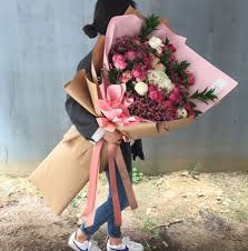 Red roses flower bouquet decorated in gold jug isolated white. How Koreans Say I Love You In A Really Big Way