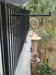 Bird Feeder Hangers For Decks Birds Enjoy Picketgrip Hangers Also Here A Bird Feeder Is Hung On The Outside Of A Balcony Guard Rail Balcony Plants Bird Feeders Bird Feeder Hangers