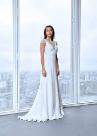 Looking For A Minimalistic Wedding Dress From A Uk Designer Look No Further Th Wedding Dress Designers Uk Wedding Dress Cap Sleeves Minimalist Wedding Dresses