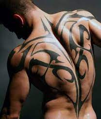 This sleeve tattoo is all about the passing of time. 60 Tribal Back Tattoos For Men Bold Masculine Designs