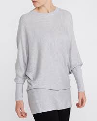 Frill trims and ruffles add interest, while cold shoulder cut outs and bardot styles flash just the right amount of flesh. Dunnes Stores Grey Marl Rib Batwing Jumper