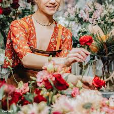 Beautiful flowers are always appreciated. Download Premium Image Of Florist Arranging Paeonia Peter Brand In Her Beautiful Bouquet Of Flowers Florist Florist Shop
