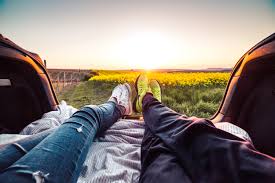 Sunsets are wonderful when you see them on your own, but they're even more special when you have someone you love by your side to take in the breathtaking sight with. Young Couple Enjoying Romantic Sunset From Car Trunk Free Stock Photo Picjumbo