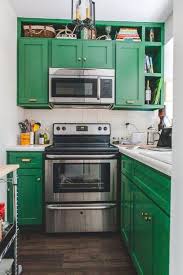 Very Small Kitchen With Green Painted Cabinets And Stainless Steel Appliances Kitchen Remodel Small Green Kitchen Cabinets Green Kitchen Decor