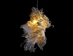 Ginkgo Studio S Poetic Curl Lamp Is Made From Old Book Pages Paper Light Feather Lamp Book Sculpture