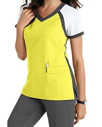 Surgical interns and residents have to wear light blue; This Athletically Inspired Scrub Top From The Popular Grey S Anatomy Brand Gives You A Fresh Look For The Seaso Fit Scrubs Nursing Scrubs Outfits Scrubs Outfit