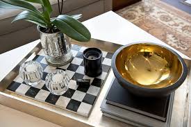 Large, hardcover books work beautifully on coffee tables. How To Improve Your Coffee Table Decor Apartment Therapy