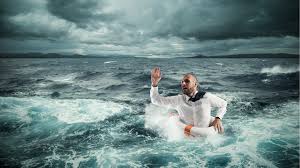 12-4-CH Man in stormy ocean in life preserver -