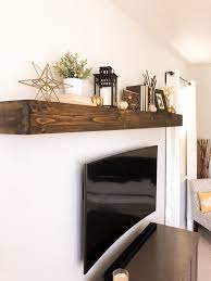 24 Beautiful Glass Floating Shelf Ideas The Shelves Are Provided Which Should Be Attached Floating Shelves Living Room Living Room Shelves Shelves Above Couch
