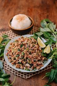 The whole salad is then tossed in a mouthwatering dressing of lime, chilli, sugar and fish sauce. Pork Larb The National Dish Of Laos The Woks Of Life
